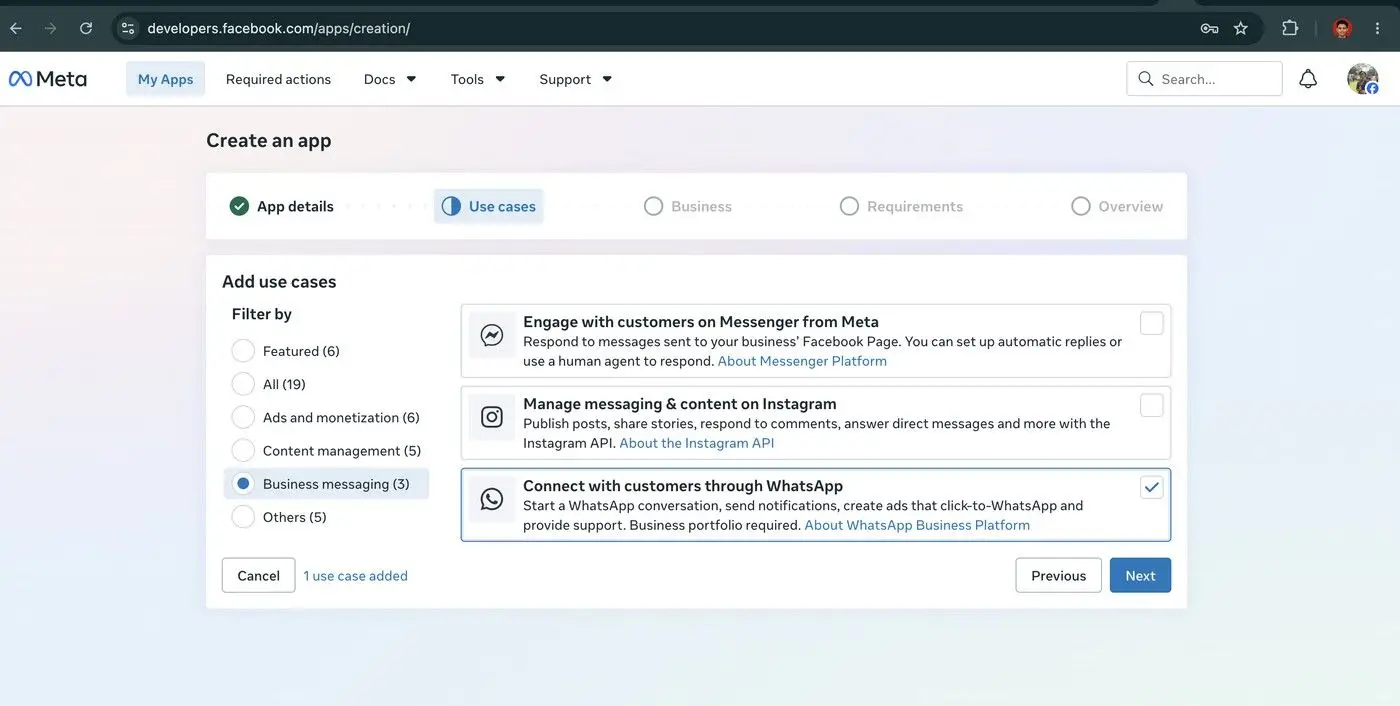 The user is creating a new app on the Meta for Developers platform. They are currently on the 'Use cases' step, where they have selected 'Business messaging' as a filter and have chosen to connect with customers through WhatsApp.