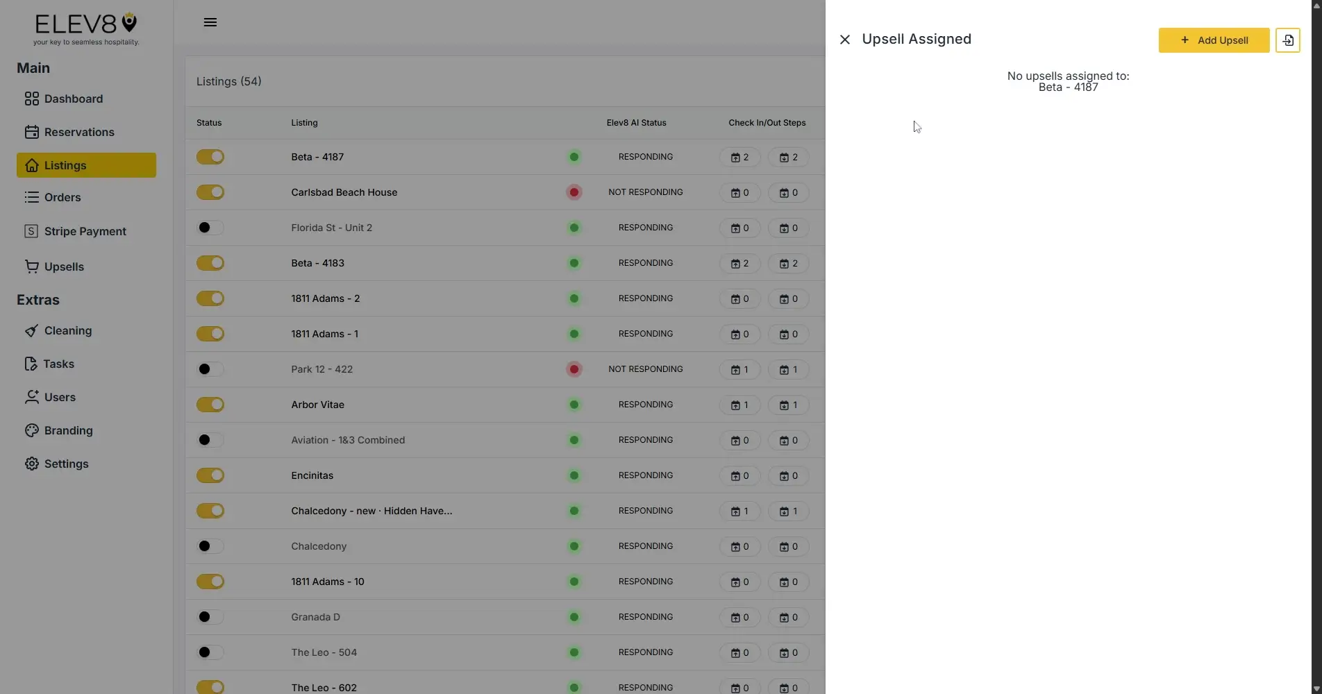 ELEV8 platform Listings page showing property statuses and upsell assignment.