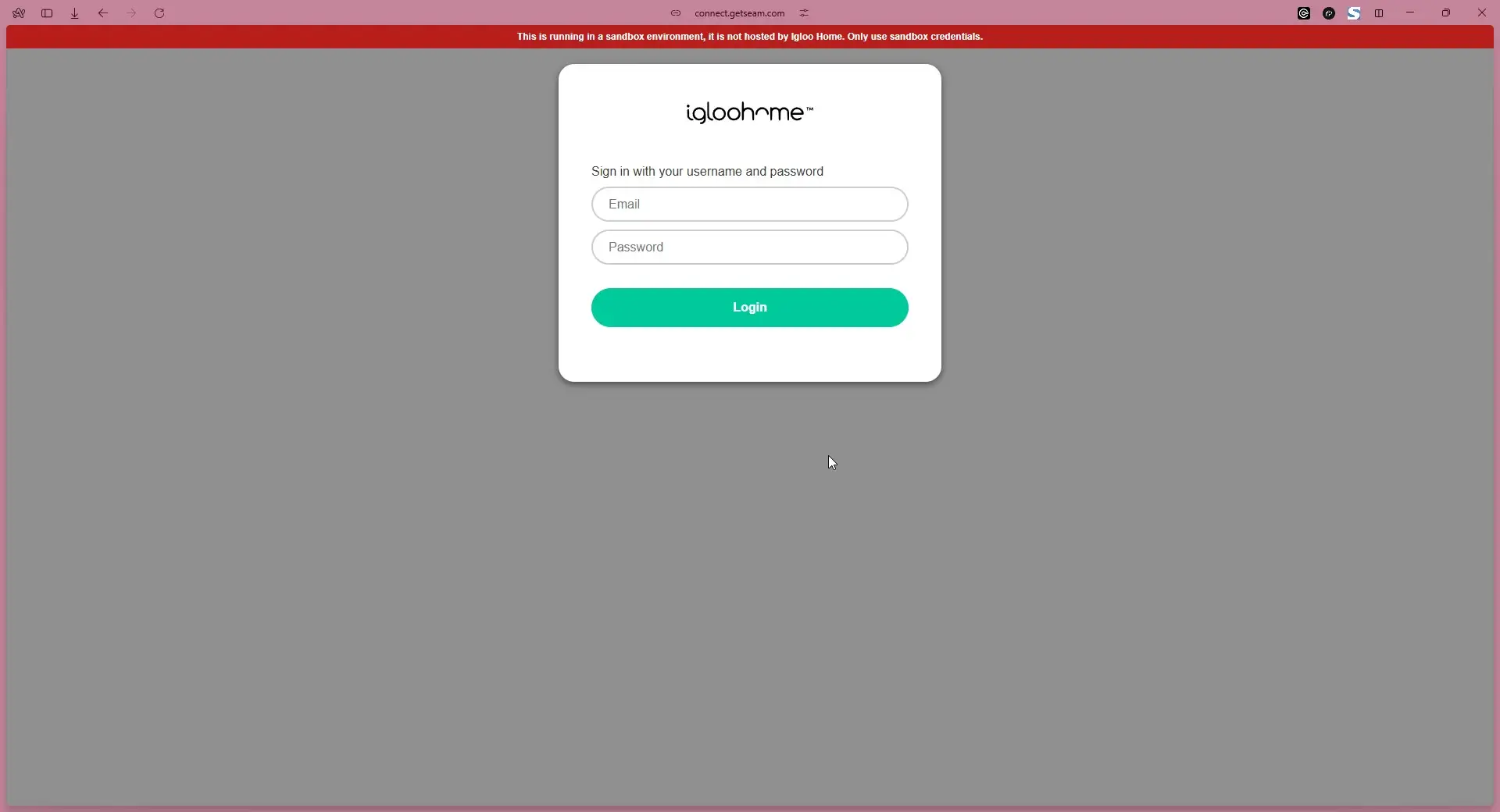 Igloohome login page in sandbox environment with email and password fields.